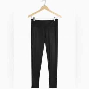 JoyLab size medium black sparkly leggings with pocket for essentials.